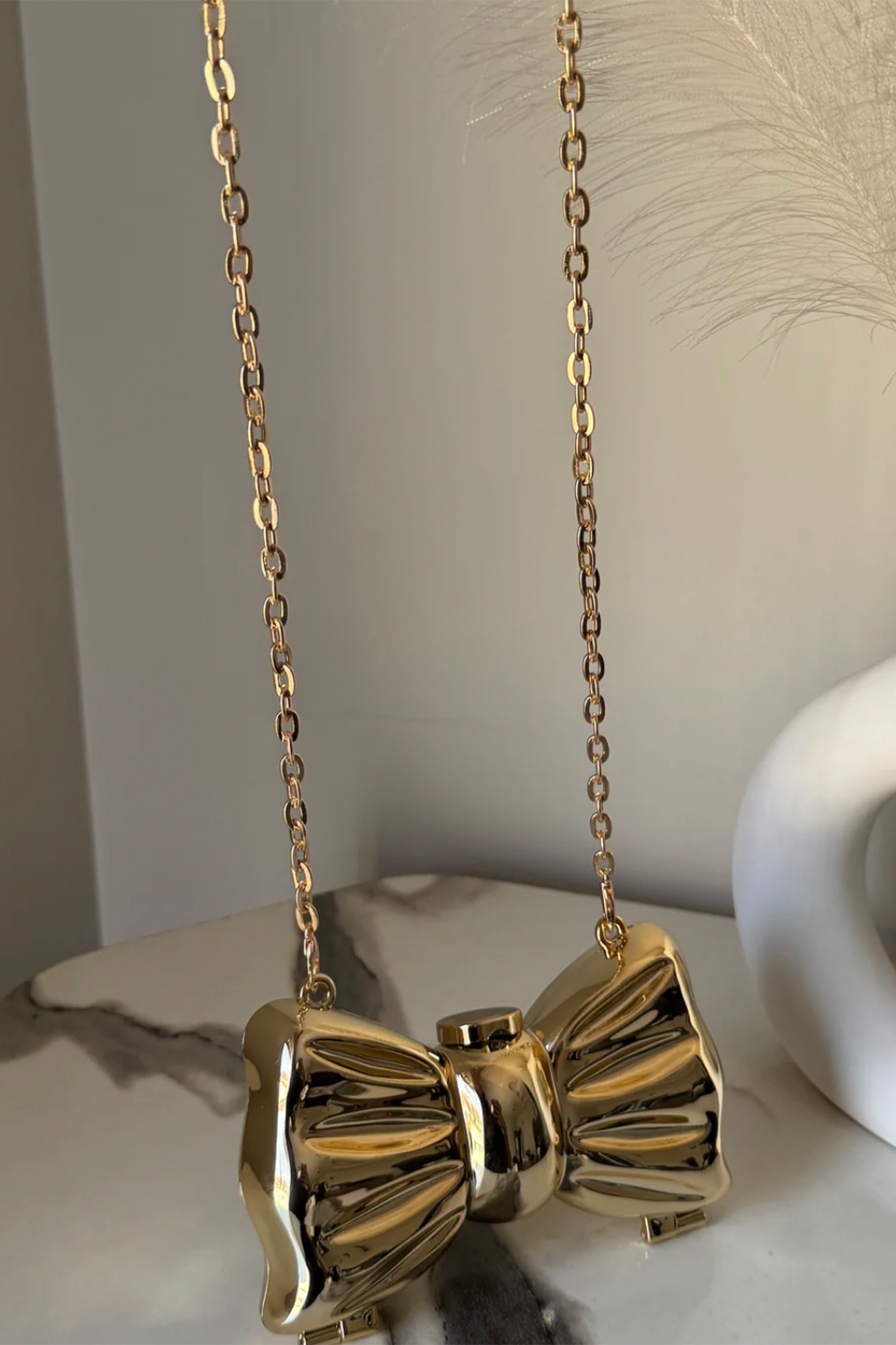 Viral Mini Gold Bow Clutch